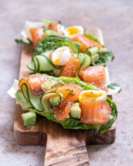 Lettuce wrapped smoked salmon tacos with fresh cucumber, avocado and quail eggs