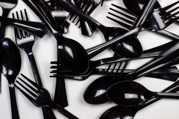 Forks and spoons on a white background. Minimal concept. Without plastic.