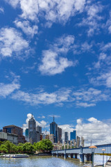 Melbourne CBD skyline and Yarra River against clear sky. Vertical orientation. Copy space.