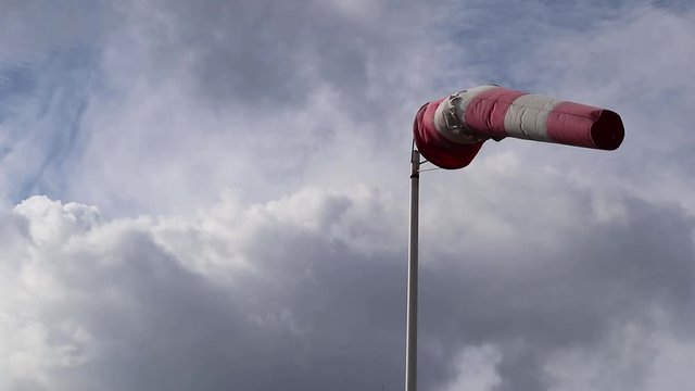 windsock against cloudy sky