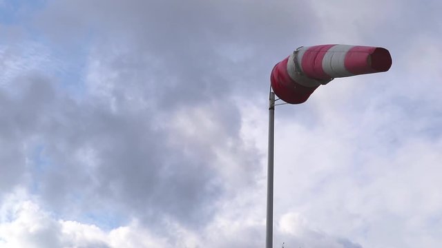 windsock against cloudy sky