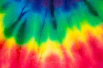 Tie dye rainbow textile fabric abstract textured . hippie and reggae style .