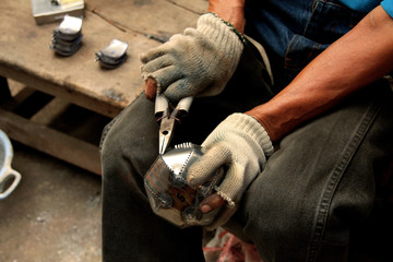 man working in factory - alms bowl