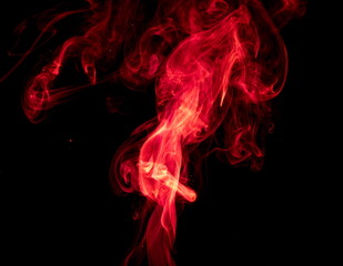Obraz premium Red smoke on black background
