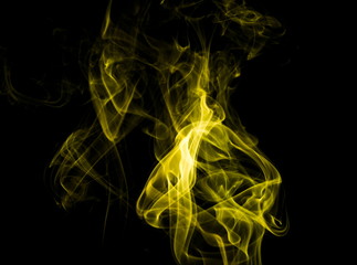 Yellow smoke on black background