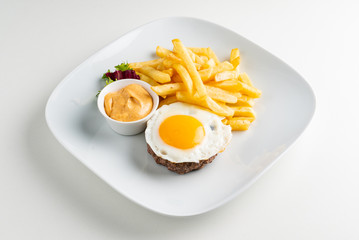 cutlet with egg and french fries