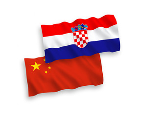 National vector fabric wave flags of Croatia and China isolated on white background 1 to 2 proportion.