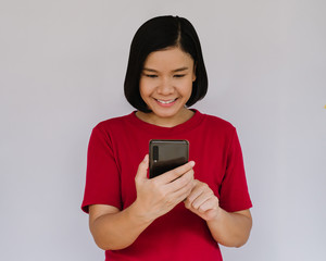 Happy smiling woman with smartphone on white background