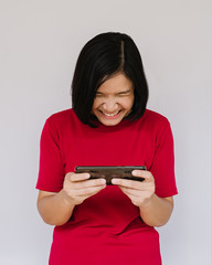 Very angry woman is shouting right on smartphone