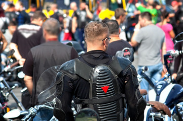 man in biker clothes on a biker party, parade of motorcyles