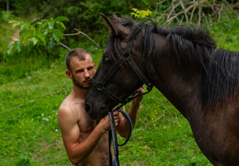 man pressed his face to the horse's muzzle