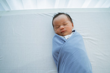 cute little daughter when adorable sleep on the bed