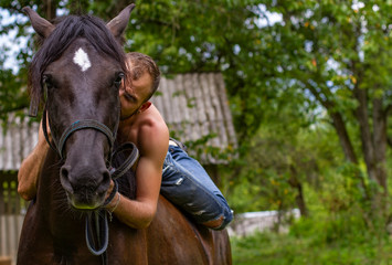 man with a naked torso riding horse