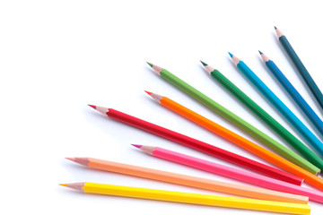 Bright colored wooden pencils in the corner of the picture isolated on a white background