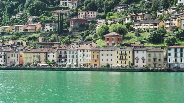Houses and green landscape on Lake Lugano in Morcote