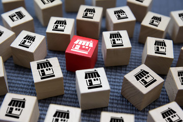 Franchise business marketing icons Store on wooden block for business growth concept.