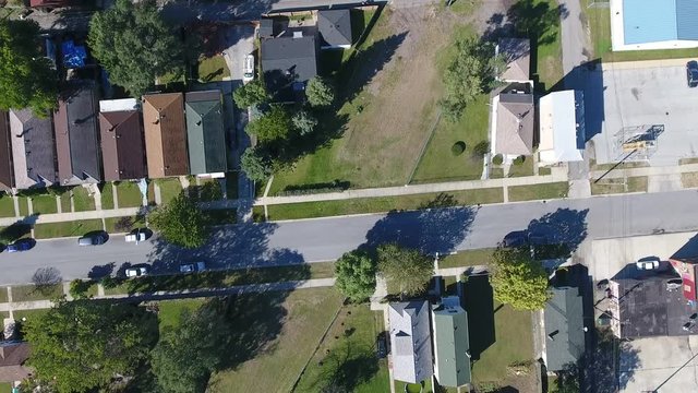 Residential neighborhood streets of affordable houses in midwest USA, aerial drone shot looking down