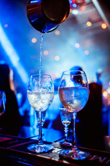 Refreshing Delicious Orange Alcoholic Cocktail With Ice In Glass Covered Drops Or Splashes Of Water. Pleasant Evening In Respectable Restaurant With Cocktail.