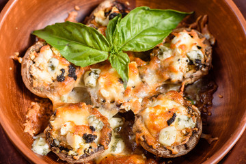 Caps of mushrooms champagne stuffed with four varieties of cheese and baked. Traditional Italian Mushroom Caps stuffed with Feta
