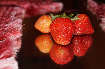 strawberries on black background