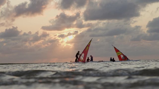Windsurfers training during sunset with beatiful water reflections.
Shot in 4k at 24fps in 12 Bit Raw. Apple ProRes file.