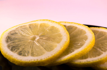 lemon slices on a black plate