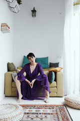 female with short haircut poses in Tbilisi loft