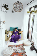 female with short haircut poses in Tbilisi loft