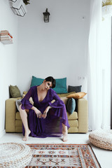 female with short haircut poses in Tbilisi loft