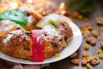 typical portuguese fruit cake Bolo rei on wooden background