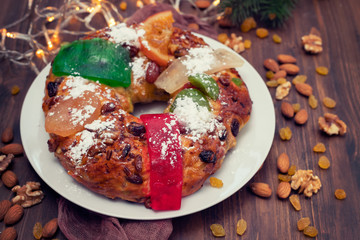 typical portuguese fruit cake Bolo rei on wooden background