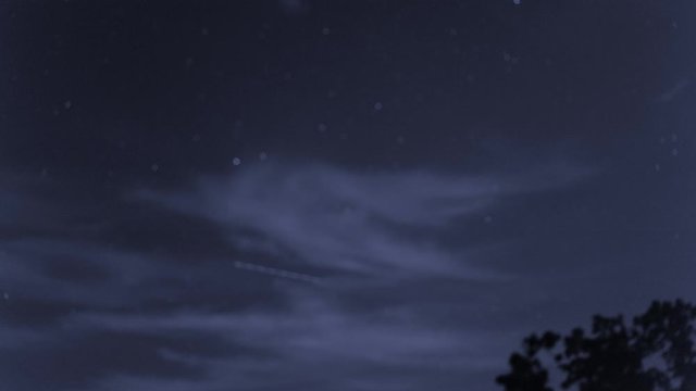 Timelapse, low angle, night cloudscape with stars, North Carolina