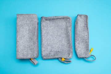 fabric pencil cases on blue background