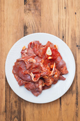 raw meat with herbs and garlic for grill on dish