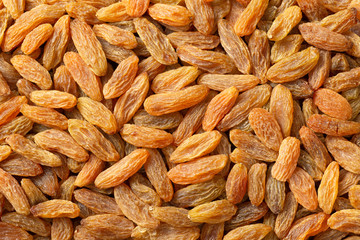 food background of yellow raisins, full frame, top view