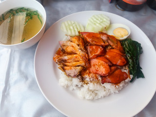 Sliced Glazed Pork or Tom Khem served with rice and hard boiled egg, a traditional comfort food in Laos