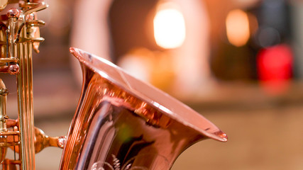 Close up of woman musician singing her saxophone