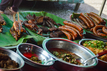 Authentic laotian street food sold in the famous Luang Prabang morning market in Laos