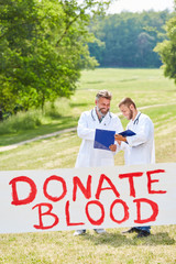 Doctors advertise with poster for the blood donation