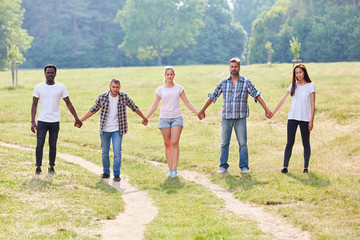 Group of students holds hands