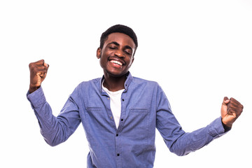 Young african man with raised hands celebrate victory isolated on white background