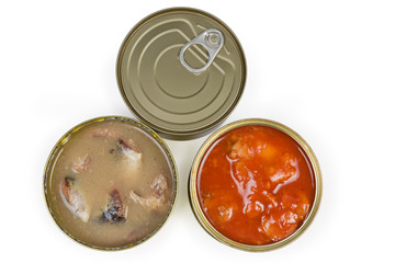 Sealed and open tin cans of canned fish, top view