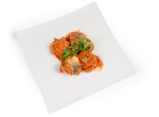 Canned fish in tomato sauce on square dish