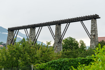 Remains of the old aqueduct in Laas on a cloudy day in summer