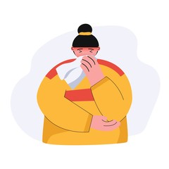 A young women wipes his nose with a handkerchief, he has a cold and a headache.