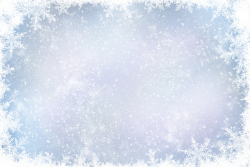 Decorative Christmas background with bokeh lights and snowflakes.