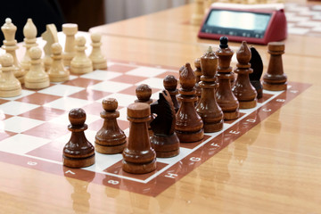Chess pieces are placed on a special game table. The concept of sports equipment for the game of chess. Development and promotion of intellectual games in the world