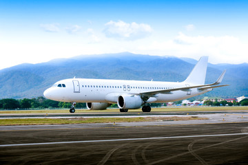 Fototapeta na wymiar Commercial modern white airplane with nice sky,Happy journey and holidays concept. Aviation and transportation.