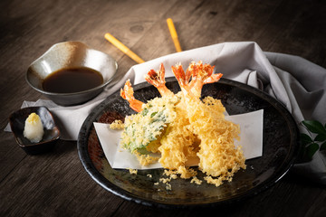 The tempura shrimps with sauce, deep-fried shrimps in the traditional Japanese restaurant.