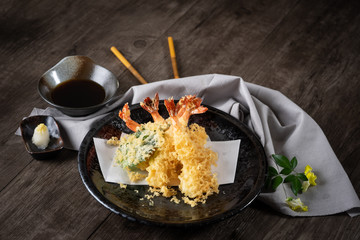 The tempura shrimps with sauce, deep-fried shrimps in the traditional Japanese restaurant.